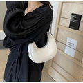 White crescent underarm bag with lychee texture and metallic side buckle details - Off White