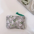 Flat lay of a floral cotton coin purse with green pull cord and decorative accessories - Light Grey with White Gardenia