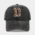 Detail of leopard print letter D embroidery on washed charcoal grey cotton baseball cap - Leopard Alphabet D Pattern