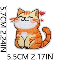 Close-up showing the 5.7cm x 5.5cm dimensions of the cute yellow cat embroidered patch - Waving Orange Yellow Kitten Style