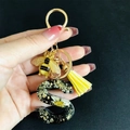 Resin initial S keychain with dried flowers, gold foil, bee charm and yellow tassel - Letter S