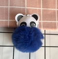 Detailed view of panda keychain with large blue faux fur pom-pom and gold metal ring - Sapphire Blue