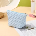 Quilted light blue cosmetic bag in diamond pattern with zipper and portable handle - Trapezoid Bag / Light Blue