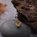 Macro view of a square-cut yellow gemstone pendant on a natural stone background - Natural Citrine Square Pendant Silver
