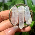 Golden circular hair clip with raw natural crystals held by hands with glitter nails - Gold Circle Clear Crystal Slice