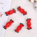 Five handmade red fabric candy ornaments with green ruffles for Christmas DIY decor - Candy / Red