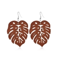 Detailed view of monstera leaf wooden earrings with silver metal hooks on white background - Style 40