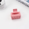 Matte pink square hollow hair claw clip with multi-teeth grip on a minimal desk - 5cm / Light Pink