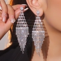 Luxurious silver long tassel rhinestone drop earrings shown on model for elegant brides - Layered Gradient Tassel / Silver