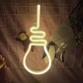 Bulb-shaped LED neon sign with warm white spiral filament and USB cable on pink wall - 1-2W / Bulb Warm White