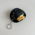 Mini black felt cowboy hat keychain featuring a yellow sunflower and silver metal keyring - Black Hat + Sunflower