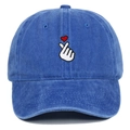Detailed view of heart finger embroidery and washed cotton fabric on the baseball cap - Sapphire Blue