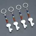 Chakra gemstone heart key pendant set with white turquoise stone in silver keychain - Howlite