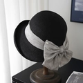 Elegant black straw bucket hat with a wide grey velvet bow and metallic badge detail - Black (80468# Letter D)