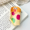 Chic beige acrylic hair claw clip with colorful monster pattern on vintage book - Seal