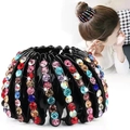 Macro detail of bird nest hair clip with colorful rhinestones and velvet finish - Colorful Rhinestone