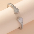 Silver twisted cable cuff bracelet featuring diamond-encrusted floral ends for women - Silver