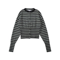 Detailed close-up of a black and white striped knit cardigan with fine front buttoning - Black Striped Top