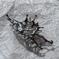 Macro detail of silver liquid metal hair claw clip with irregular 3D butterfly hollow design - No. 4 Irregular Shape (Silver)