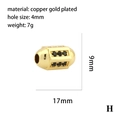 Détail macro d'une perle cylindrique en cuivre plaqué or 17mm avec zircons noirs - Perle Cylindrique Zircone Noire(P03692)