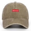 Close-up of Blessed red embroidery patch on vintage washed khaki baseball cap fabric - Khaki
