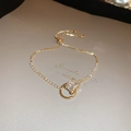 Vergoldetes Kleeblatt-Armband mit Zirkonia-Steinen und verstellbarem Zugverschluss - 18K Vergoldetes Zirkonia-Armband mit Kordelzug / Gold