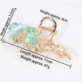 Large golden alloy shark clip with blue lotus flower, green leaves and pearls - HS02637 Blue