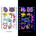 Glow-in-the-dark temporary tattoo sheet with tiger and owl patterns under UV light - Fluorescent DWYG-010