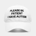 Close-up of white cotton baseball cap featuring black embroidered autism awareness slogan - Adjustable / White