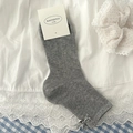 Chaussettes mi-mollet en tricot gris avec texture côtelée et détail nœud argenté - Taille unique / Gris clair