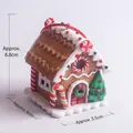 Detail of gingerbread house hanging ornament with white icing and red candy accents - Christmas House 16 (Brown Candy)