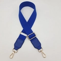Close-up of royal blue woven strap with gold metal buckle and leather reinforcement - Sapphire Blue / Silver