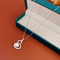Close-up of zircon gourd pearl pendant necklace in a premium dark green jewelry gift box - Silver Gourd Pearl Necklace