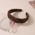 Detailed view of handmade brown plaid tweed headband with textured wool fabric - Brown Orange Plaid