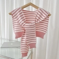Pink and white striped knitted shawl collar with ribbed edges on a wooden hanger - Pink White Stripe