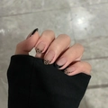 Detail view of handmade French press-on nails with nude base and black leopard patterns - BY1675 Black Edged Lip Print / Glue Type