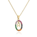 Macro detail of gold-plated oval necklace with multicolor zircon stones and letter H - Letter H