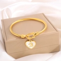 Gold twisted cable bracelet with a heart charm featuring letter B engraving - Letter B