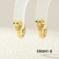 Macro shot of gold cobra hoop earrings with green stone eyes on a clear stand - ER0841-B/Gold/Green Eyes