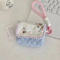 Floral CCD camera case with blue stripes, purple pom-poms, and pink braided strap - Floral Orange + Blue Stripes