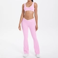 Detail of high-waist V-shaped waistband on pink yoga flare pants with white contrast piping - Sakura Pink