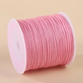 Spool of light pink 0.8mm nylon cord for handmade jewelry and DIY craft projects - Pink