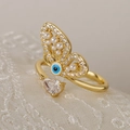 Gold butterfly ring with evil eye design, pearls and pear-shaped zircon on lace background - 13168 / Blue Eye