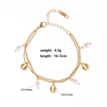 Detail of gold double-layer bracelet with seashell charm and pearl showing 16+5cm length - Style 10-Pearl Conch