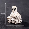 Ghost sitting on skull pile figurine made of resin, Halloween decor size 3.3x3.1cm - Style 25 Skull Pile