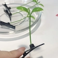 Cute green sprout hair clip with black duckbill base for creative styling - Grass
