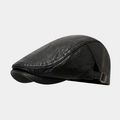 Close-up of black leather flat cap showing retro wrinkled texture and side metal buckle - One Size / Black