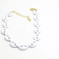 Detail of white coffee bean link necklace featuring gold adjustable chain and lobster clasp - White