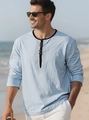 Detail of light blue linen-textured casual long-sleeved polo shirt for beach vacations - Light Blue