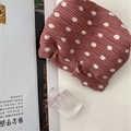 Detail of pink polka dot crinkle fabric makeup bag with elegant pleated texture - Pink Polka Dot Shrapnel Bag